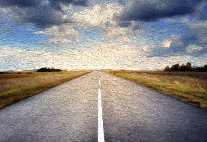 road-in-fields-under-clouds-after